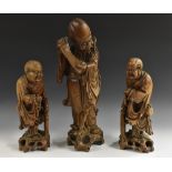 A pair of 19th century Chinese hardwood carvings, of Buddhistic sages,