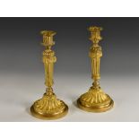 A pair of 19th century Louis XVI Revival gilt-patinated bronze candlesticks,