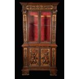 A Renaissance Revival walnut and parcel-gilt bookcase,