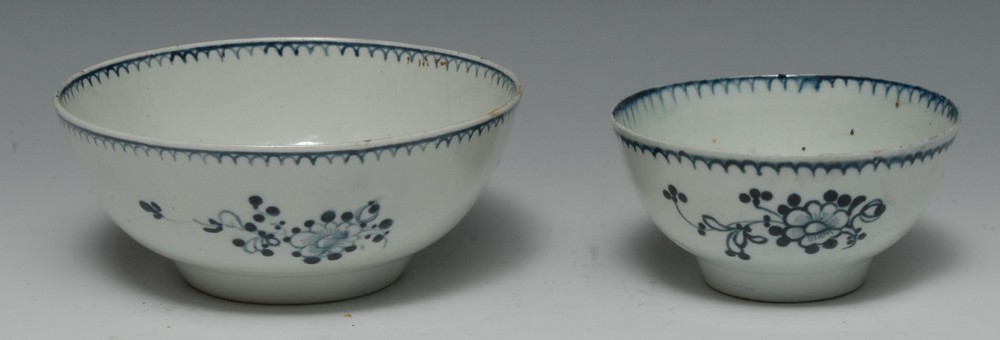 A Liverpool bowl, decorated in underglaze blue with three stylised flower sprays,