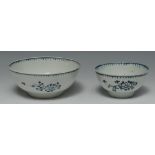 A Liverpool bowl, decorated in underglaze blue with three stylised flower sprays,