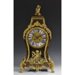 A Napoleon III gilt metal mounted boulle cartouche shaped mantel clock,