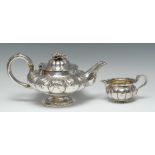 A George IV silver lobed melon shaped teapot and cover, embossed with flowerhead and leaves,