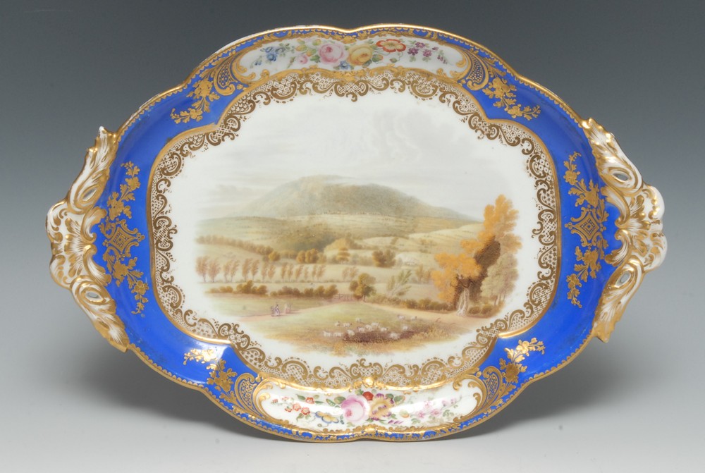 A Worcester two handled shaped oval dish, painted with a view of The Wrekin, Shropshire,