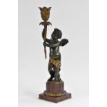 French School (19th century), a brown patinated bronze and Griotte marble figural candlestick,