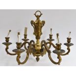 An early 20th century ormolu six branch electrolier, cast with scrolling acanthus,