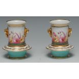 A pair of 19th century Coalport spill vases, painted with flowers, turquoise bases,