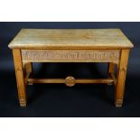 A Victorian Gothic Revival oak side table, moulded top above a deep frieze carved with a verse,