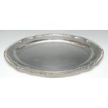 Paul Storr - a large George III silver shaped oval meat dish, gadrooned border, crested, 55.