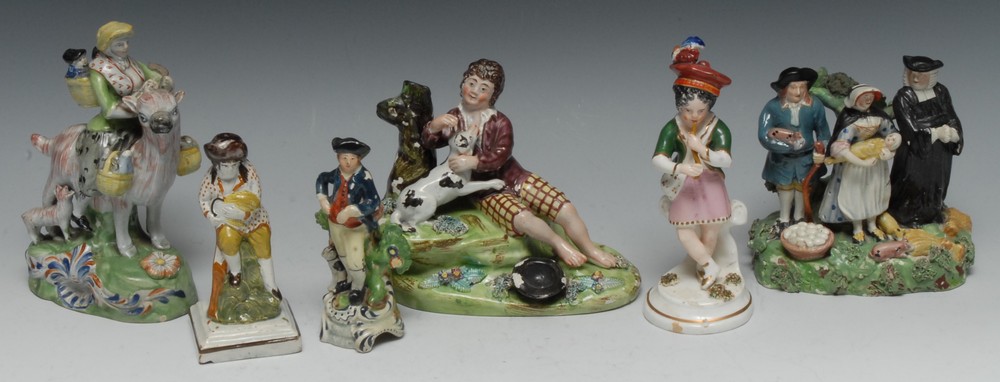 A Staffordshire Tithe Pig Group, modelled with parson and a couple,