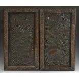 A pair of Chinese hardwood rectangular panels, each carved with a temple in a monumental landscape,