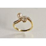 A diamond and pearl cross over ring, principle brilliant cut diamond approx 0.