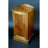 A Victorian walnut pot cupboard, shaped cresting,