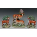 A pair of mid 19th century Staffordshire Pearlware models, of spotted stag and deer,