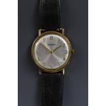 Garrard -a gentleman's 9ct gold cased wristwatch, silvered sun burst dial, Arabic numerals,