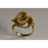 A 9ct gold modernist design writhen multi layer textured ring, as a fabric section, maker's mark HB,