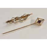 A late Victorian 9ct gold seed pearls set scrolling sinuous bar brooch, T.