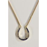 A 9ct gold horse shoe shaped pendant necklace,