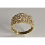 A 9ct gold openwork pave encrusted multi-later white stone set dress ring,