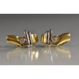 A pair of diamond set yellow and white metal clip on earrings,