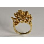 A 9ct gold modernist design multi layer textured ring, as a floral cluster, maker's mark HB, size R,