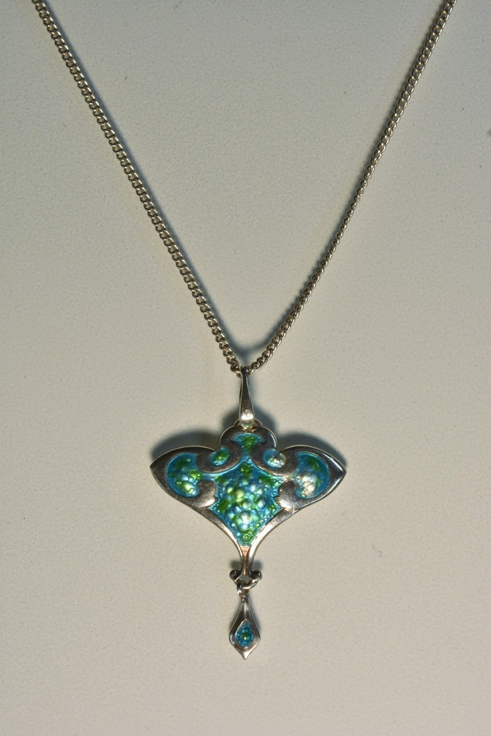 An Edward VII enamelled silver pendant,