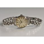 Omega - a lady's bracelet watch, silvered dial, block baton markers, manual wind Cal 620 movement,