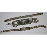 A silver identity bracelet; another; a silver Indian bracelet;