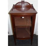 An Edwardian mahogany cabinet, shaped pierced gallery glazed door enclosing shelving, shaped apron,