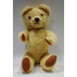 An early 20th century plush Teddy bear.