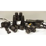 A pair of binoculars; Yashica camera; Praktica BC1,