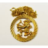 A 9ct gold circular pendant with central archer emblem, 9ct gold chain 3.