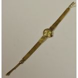 A 9ct gold lady's Tissot watch, manual, integral 9ct gold bracelet, weight without movement 11.