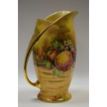 A Royal Winton water jug, decorated with ripe fruit in a landscape, gilt handle, 25cm high,