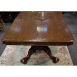 A 19th Century mahogany tilt top table rounded rectangular top tapering panelled column,