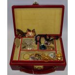 A red Moroccan leather travelling jewellery case containing gilt mounted Abalone brooch;