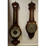 An early 20th Century oak banjo barometer enamelled dial,