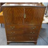A reproduction mahogany drinks cabinet, galleried top, dragooned border,