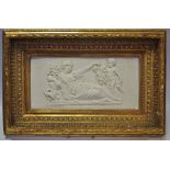 A late 19th century reconstituted marble rectangular wall plaque decorated in relief with classical