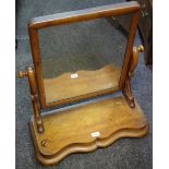 A Victorian dressing mirror, mahogany frame, shaped uprights,