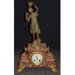 A 19th century French mantel clock surmounted with a spelter musician titled Gitana by Par