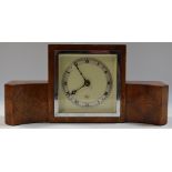 A mahogany cased mantel clock by Elliot, silvered chapter ring, Roman numerals.