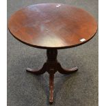 A George III mahogany tilt top circular occasional table, bird cage movement,