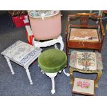 An Edwardian mahogany piano stool shaped back with pierced vasular, open arms, hinged padded seat,