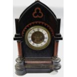 A Gothic revival Belge Noire mantel clock, open escapement, enamelled dial, Roman numerals,