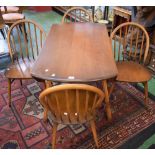 An Ercol dropleaf dining table;