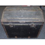 A canvas and wood bound dome top trunk Minshall Bengough label to interior