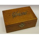 A late 19th century American oak cigar box, hinged cover applied Cigars, metal liner, 25cm wide,