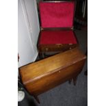 A mahogany Sutherland table; a Walker and Hall oak canteen chest barley twist legs.