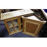 An early 20th century farmhouse pine wall unit, glazed panel doors,